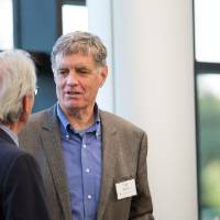 Fred Keller speaking with another guest.